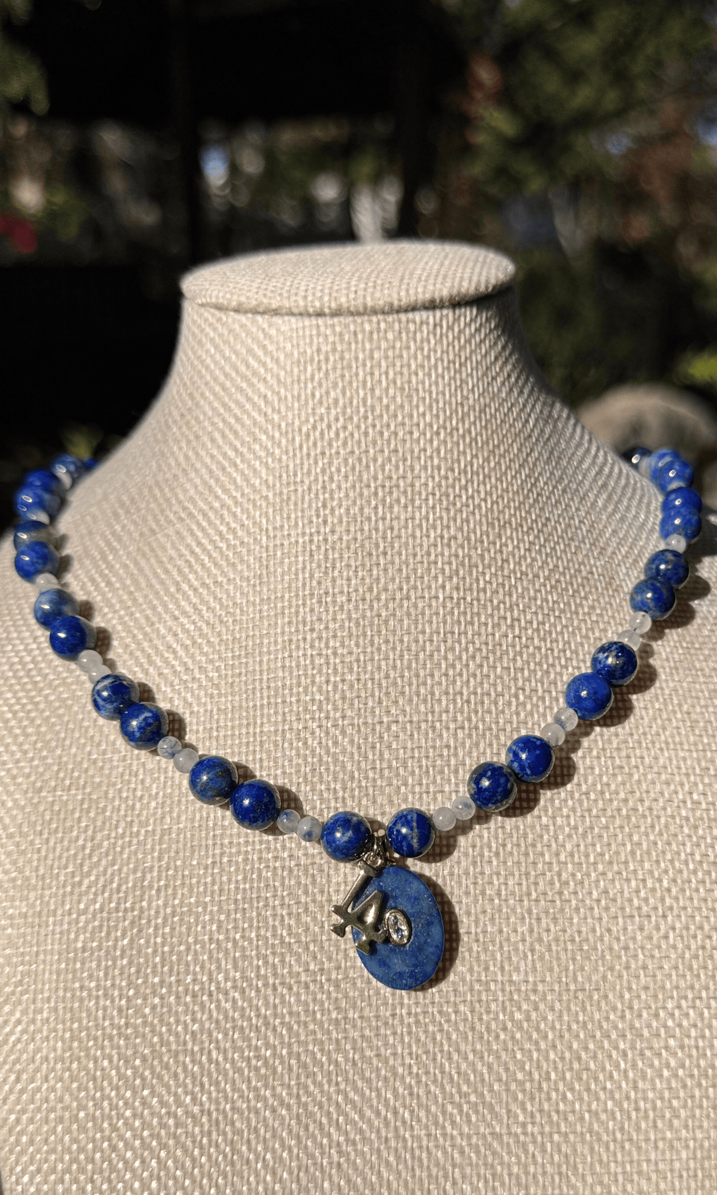 LA Dodgers inspired Lapis and Dumortiarite in Quartz necklace with Lapis and LA charms and a magnetic clasp. All metal is gold filled