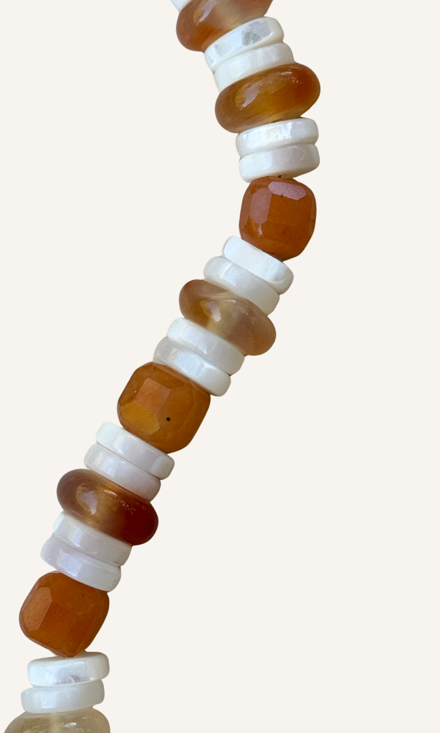 Orange Adventurine, Carnelian, and Mother of Pearl bracelet with gold filled findings and a magnetic clasp
