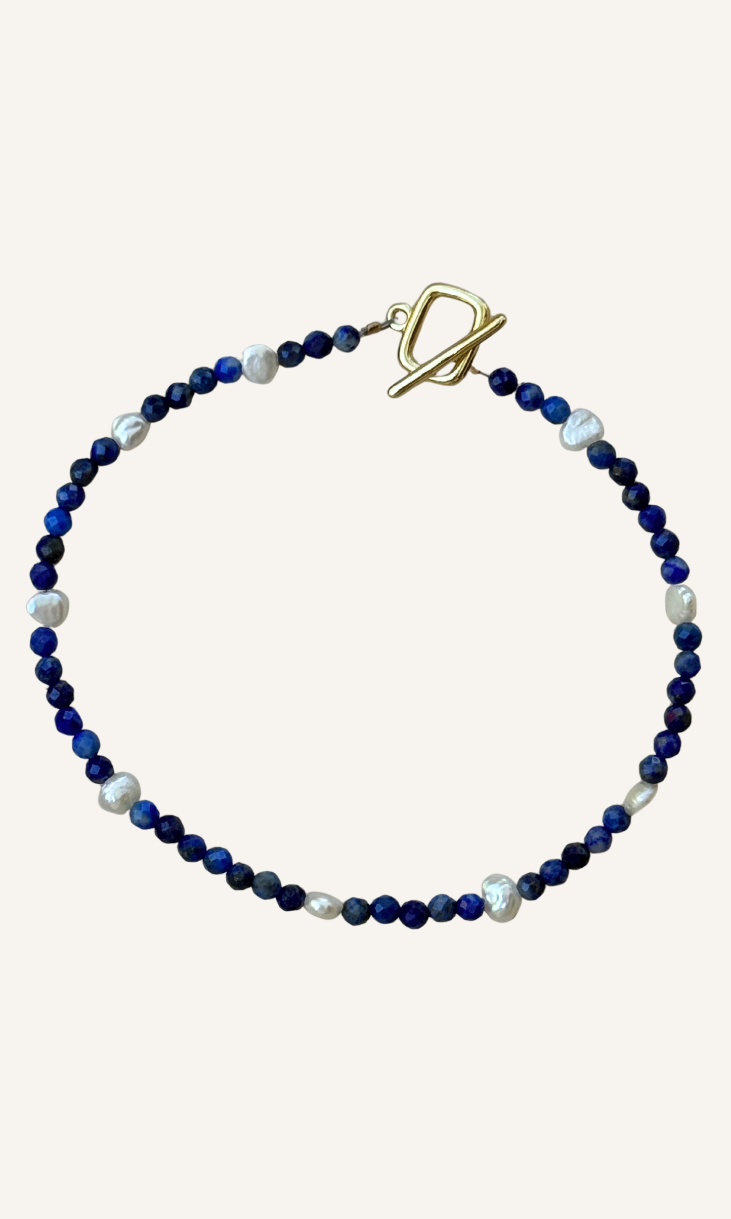 Dainty faceted lapis and tiny Freshwater Pearl bracelet with gold filled findings and a toggle closure