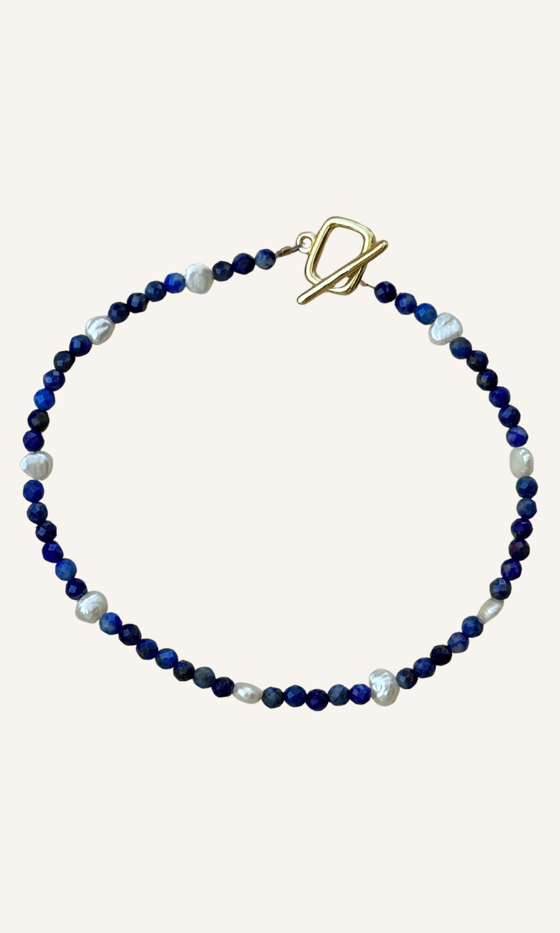 Dainty faceted lapis and tiny Freshwater Pearl bracelet with gold filled findings and a toggle closure