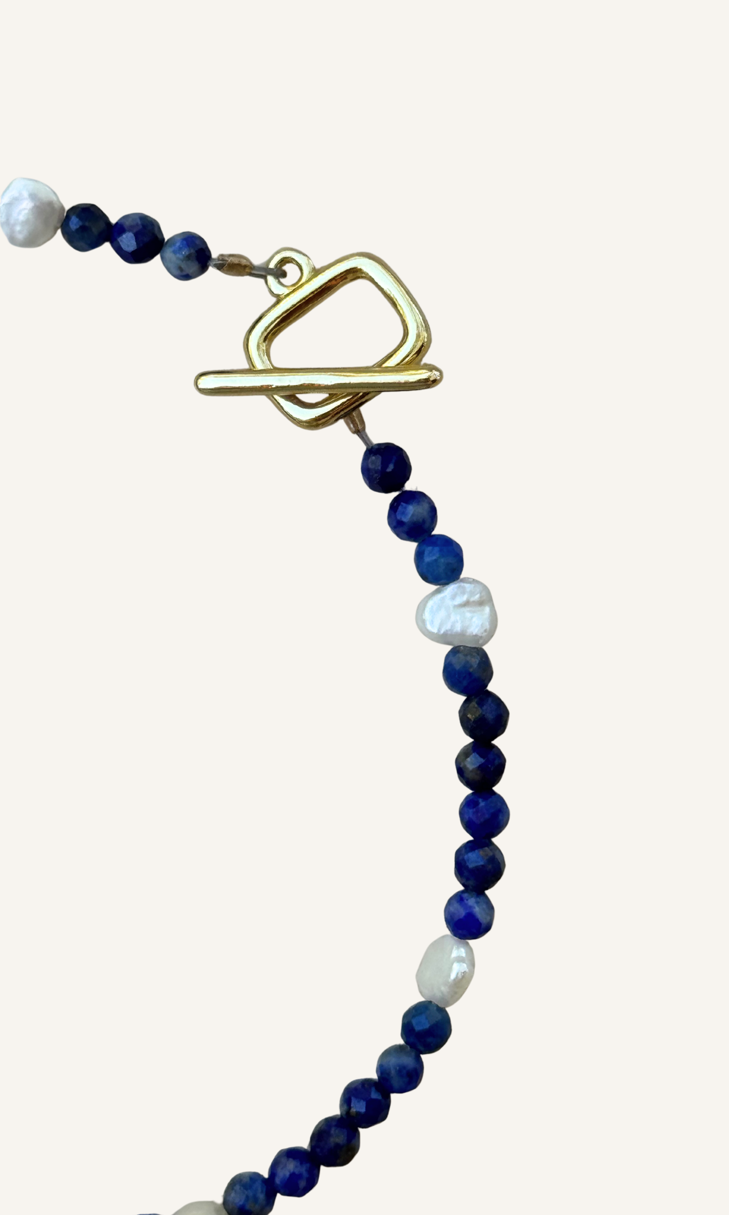Dainty faceted lapis and tiny Freshwater Pearl bracelet with gold filled findings and a toggle closure