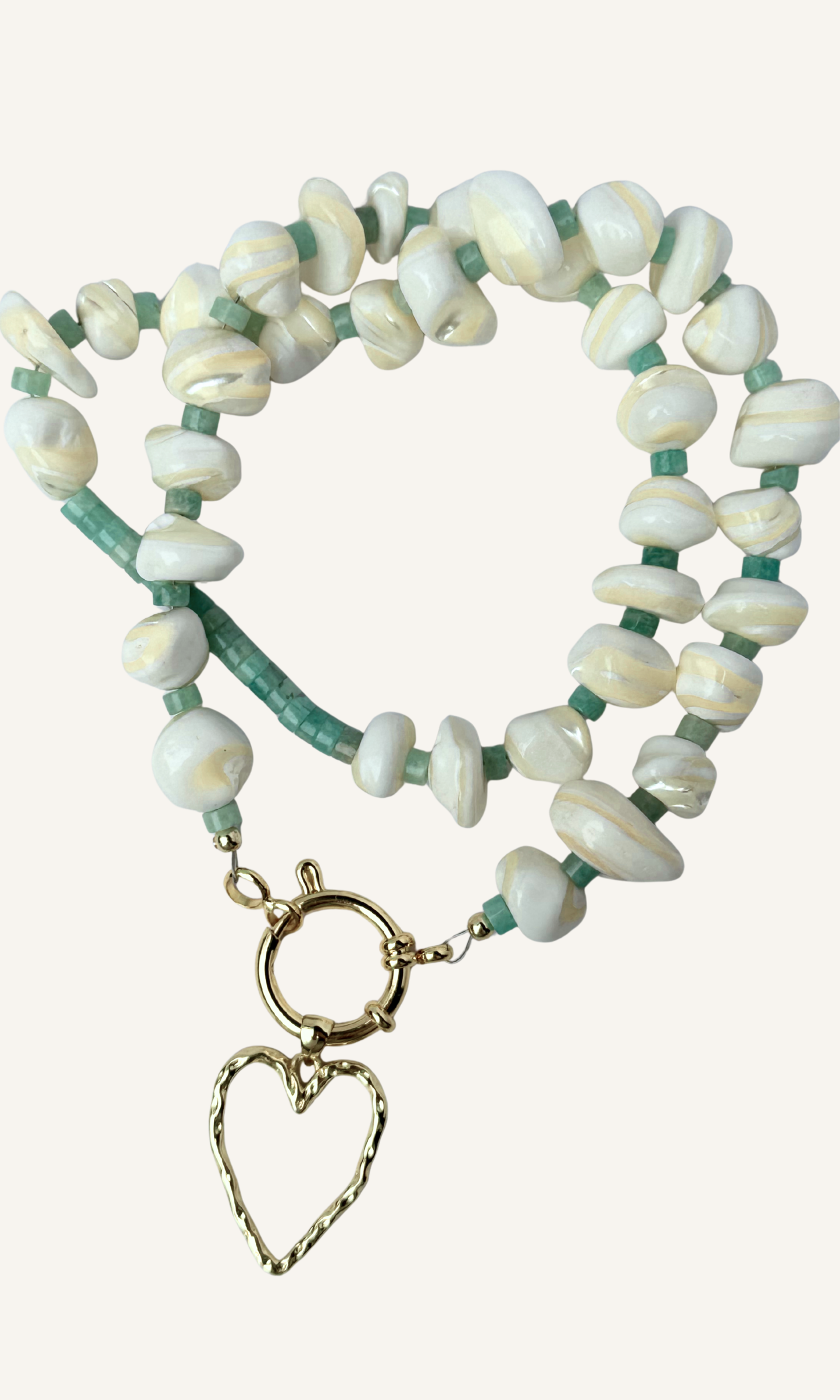 Mother of Pearl and Amazonite necklace with hammered hollow heart charm, gold filled findings, and a sailor clasp