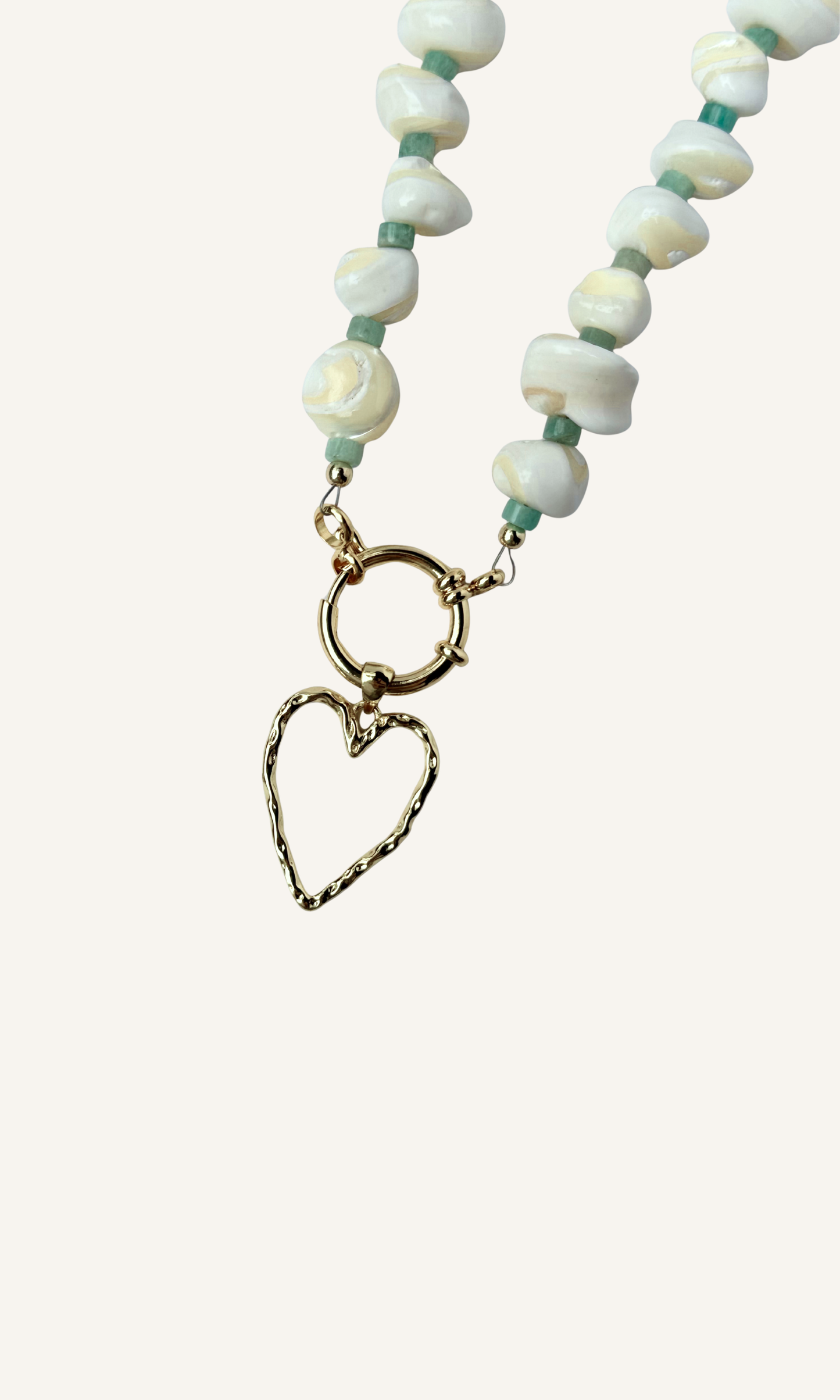 Mother of Pearl and Amazonite necklace with hammered hollow heart charm, gold filled findings, and a sailor clasp