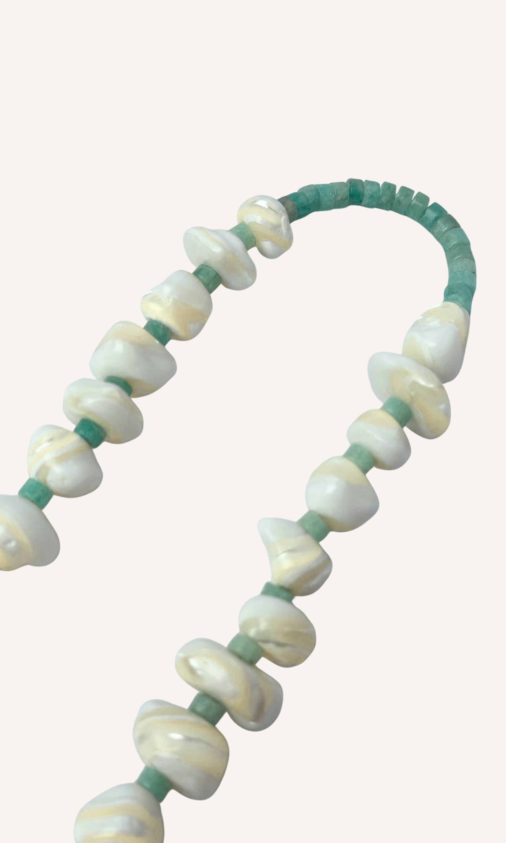 Mother of Pearl and Amazonite necklace with hammered hollow heart charm, gold filled findings, and a sailor clasp 