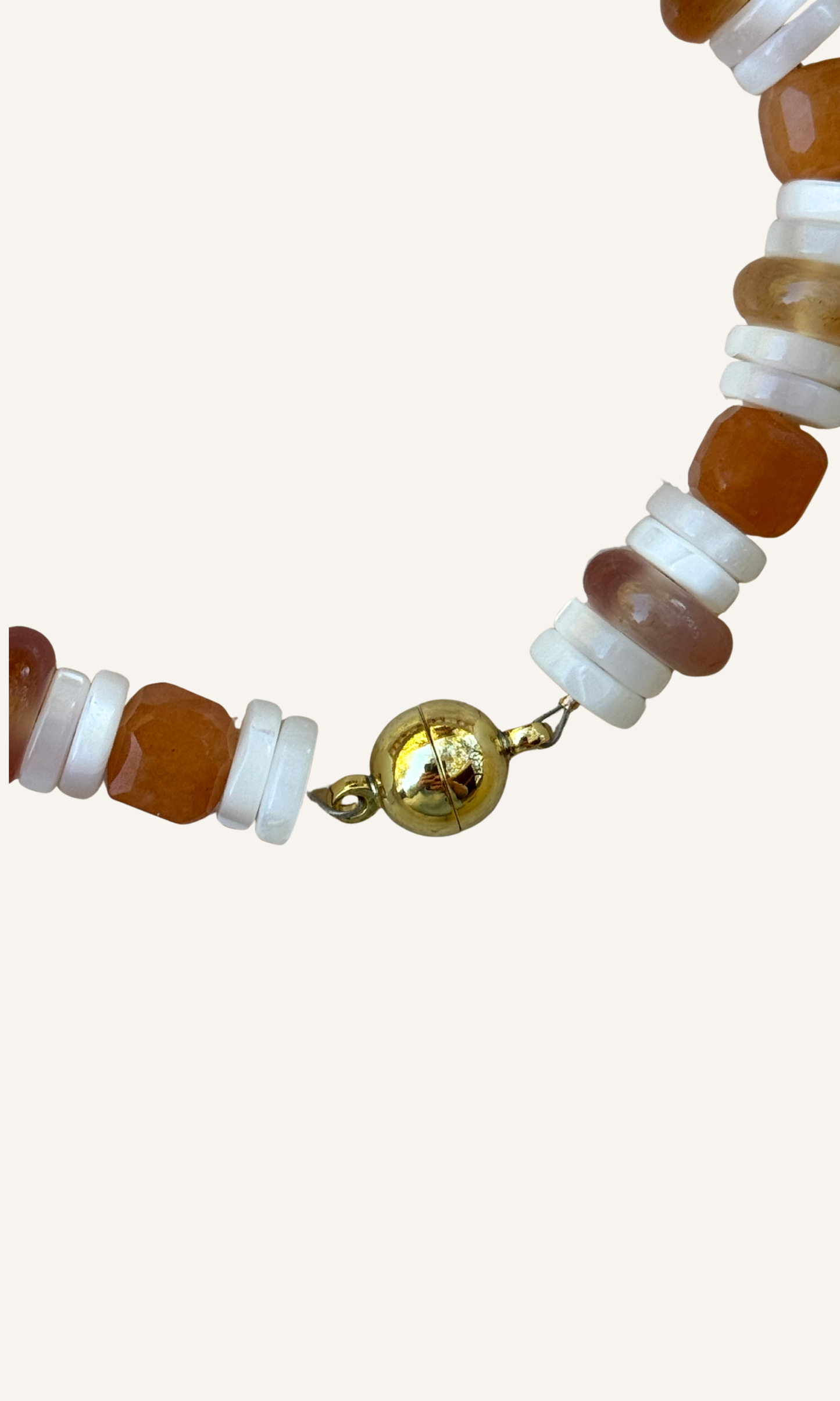 Orange Adventurine, Carnelian, and Mother of Pearl bracelet with gold filled findings and a magnetic clasp