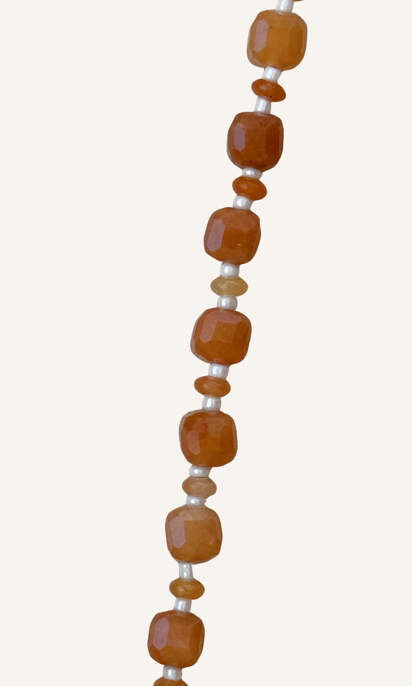 Orange Aventurine gemstones in various sizes with white spacer beads, gold filled findings, and a sailor clasp