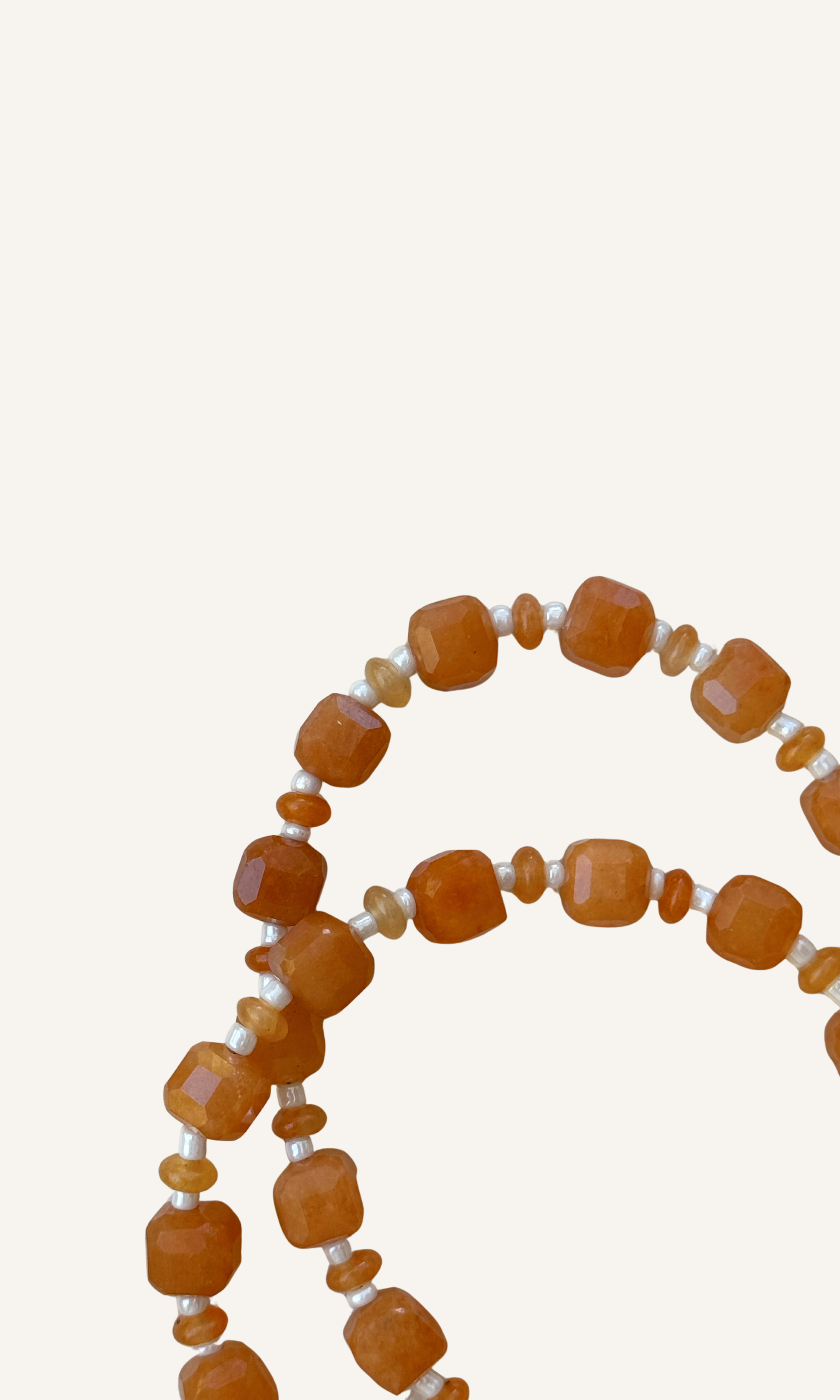Orange Aventurine gemstones in various sizes with white spacer beads, gold filled findings, and a sailor clasp