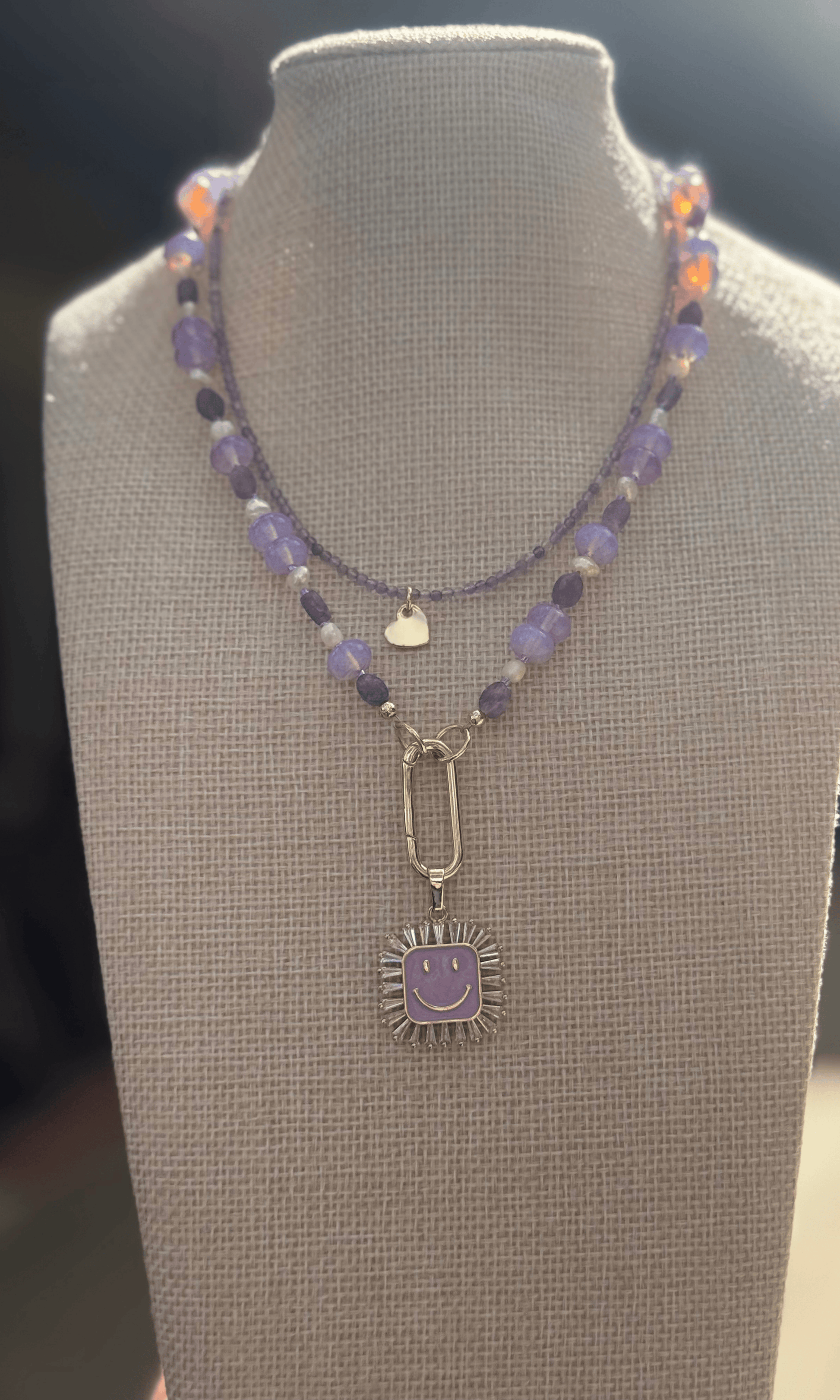 Dainty purple Amethyst necklace with gold filled heart charm and heart lobster clasp and Purple Multi-Gemstone Necklace with lepidolite, lavender quartz, freshwater pearls, and cz and enamel gold filled smiley face charm