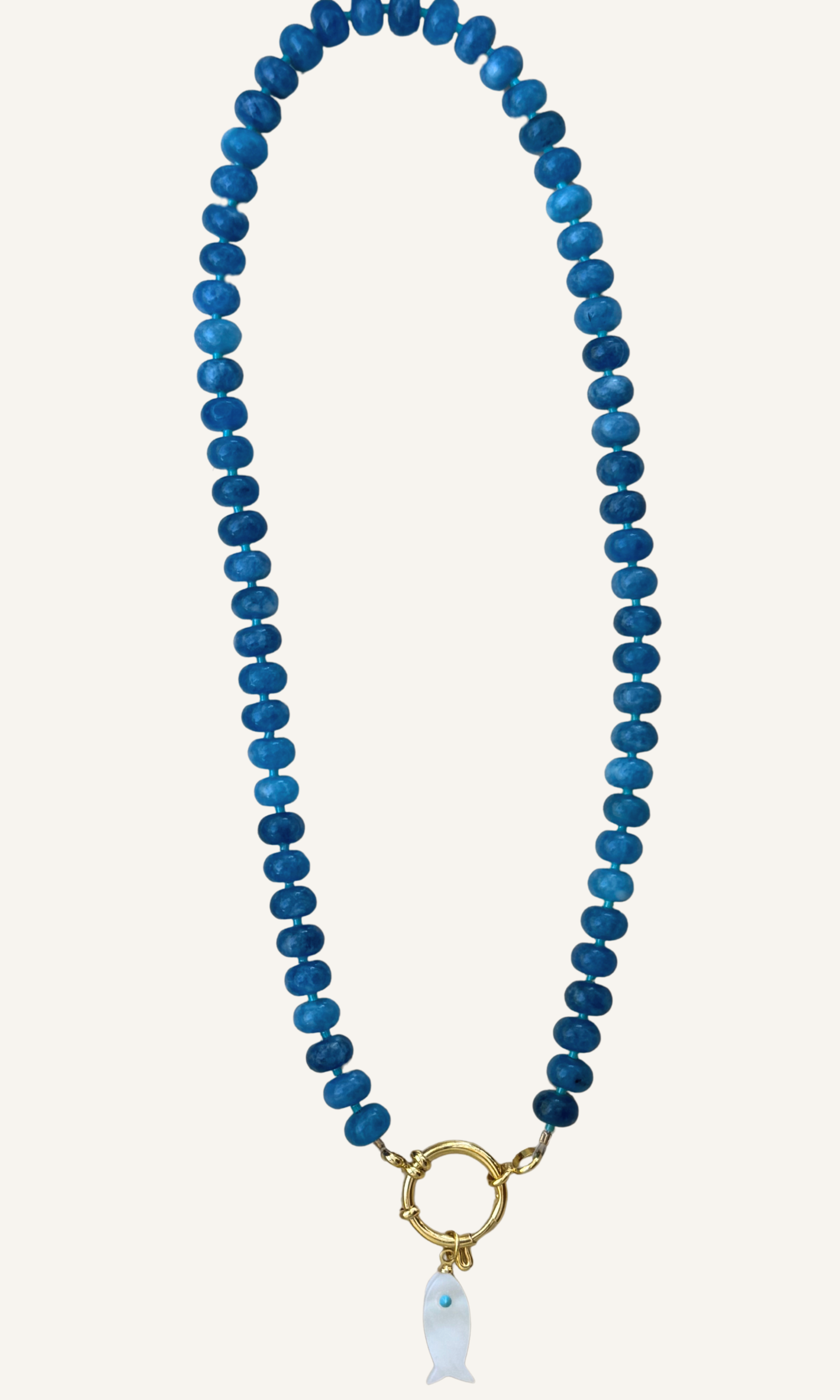 Sodalite candy necklace with a Mother of Pearl fish charm, gold filled findings, and a sailor clasp