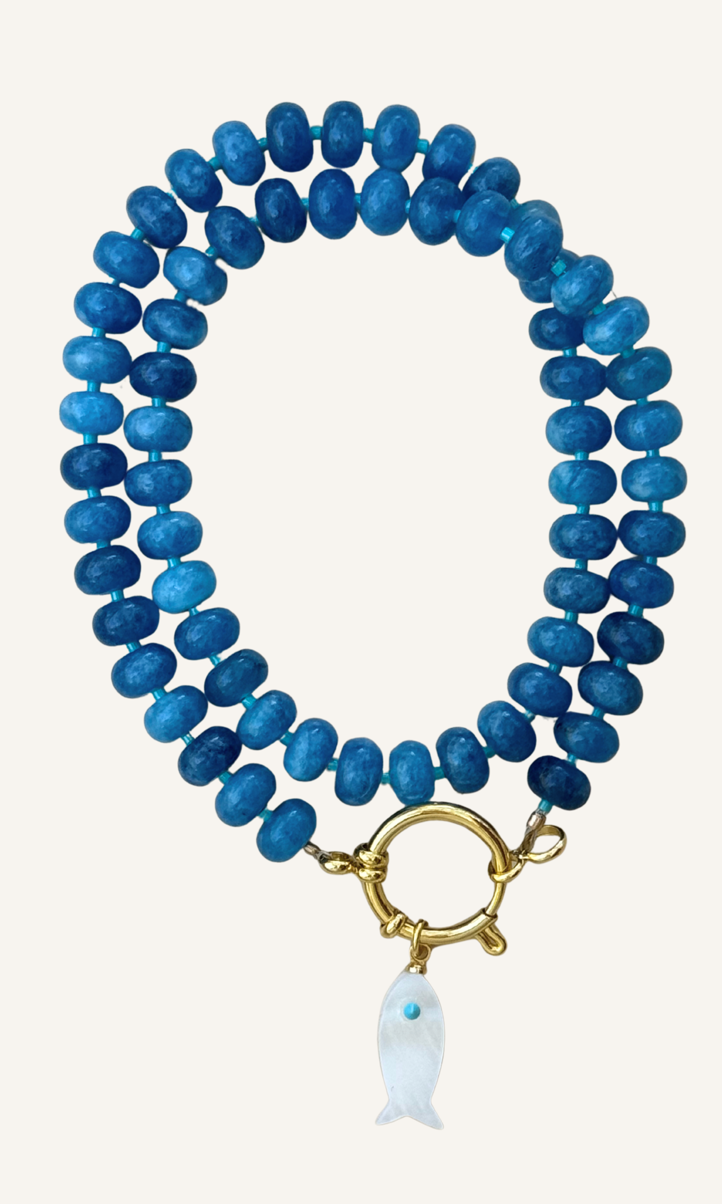 Sodalite candy necklace with a Mother of Pearl fish charm, gold filled findings, and a sailor clasp