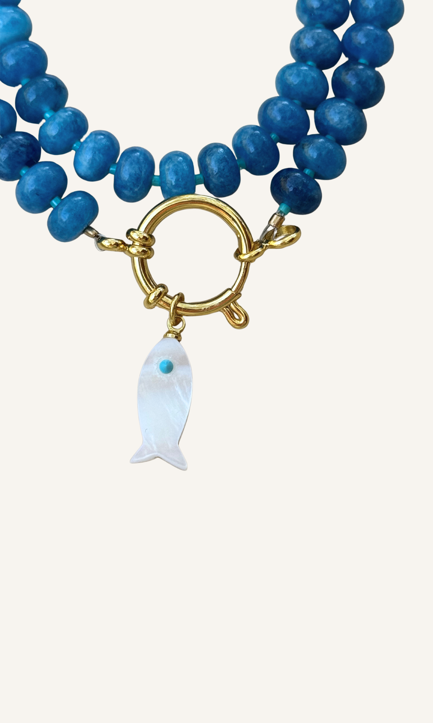 Sodalite candy necklace with a Mother of Pearl fish charm, gold filled findings, and a sailor clasp