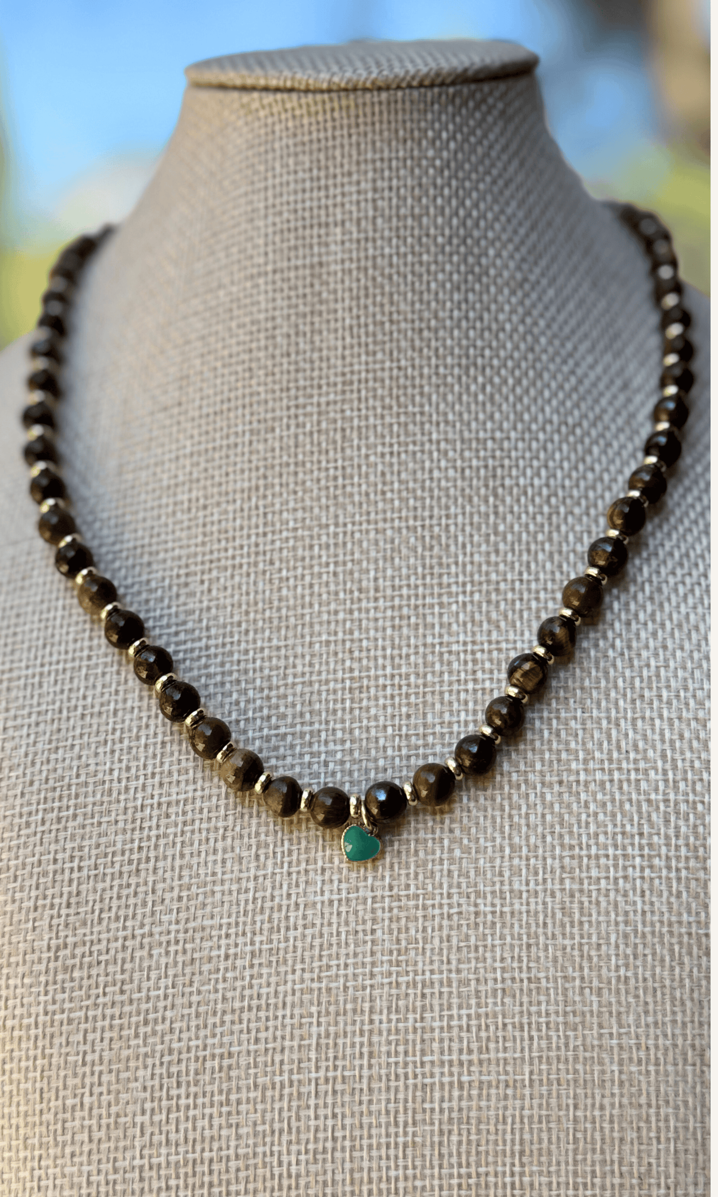 Tigers Eye necklace with dainty gold filled and turquoise colored enamel heart charm and a toggle closure