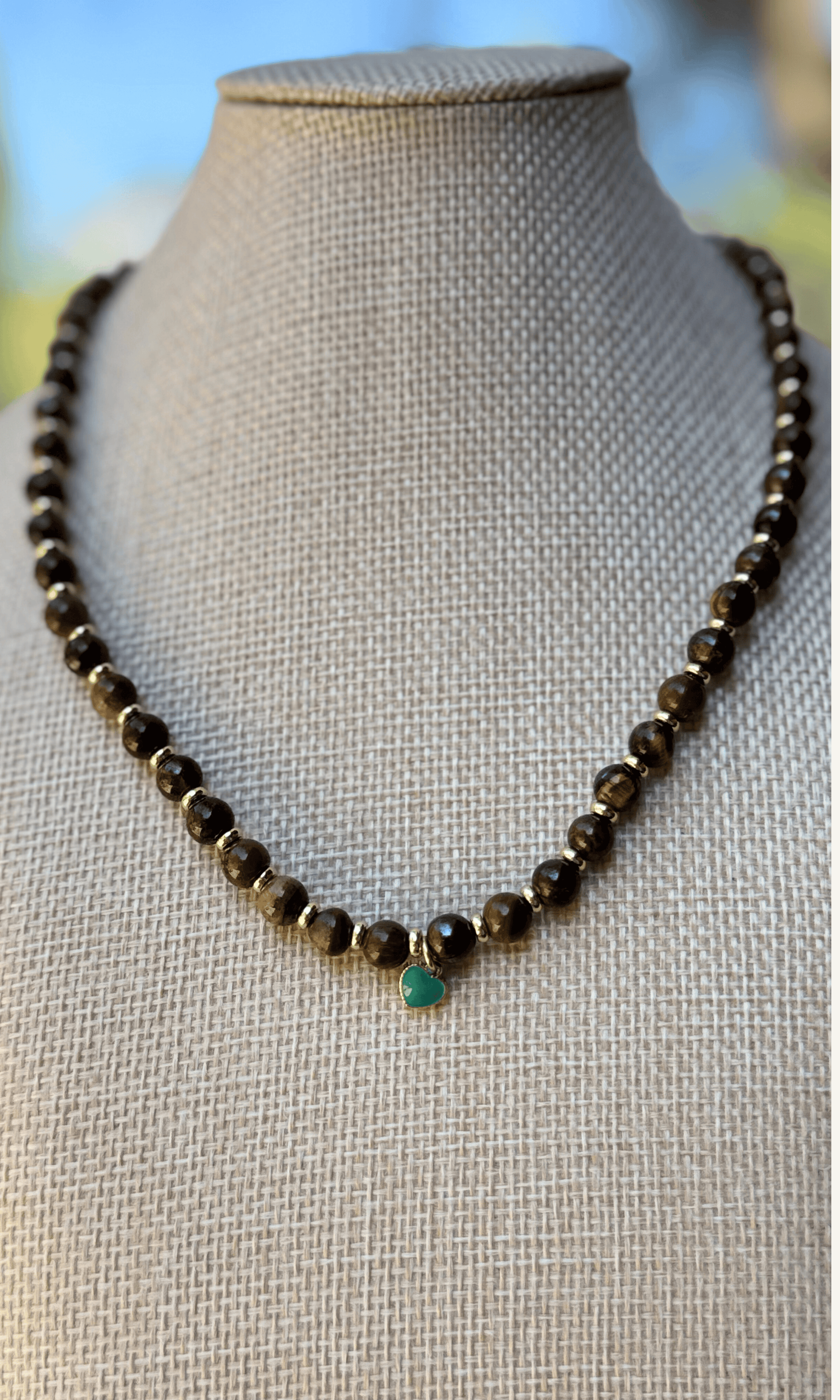 Tigers Eye necklace with dainty gold filled and turquoise colored enamel heart charm and a toggle closure