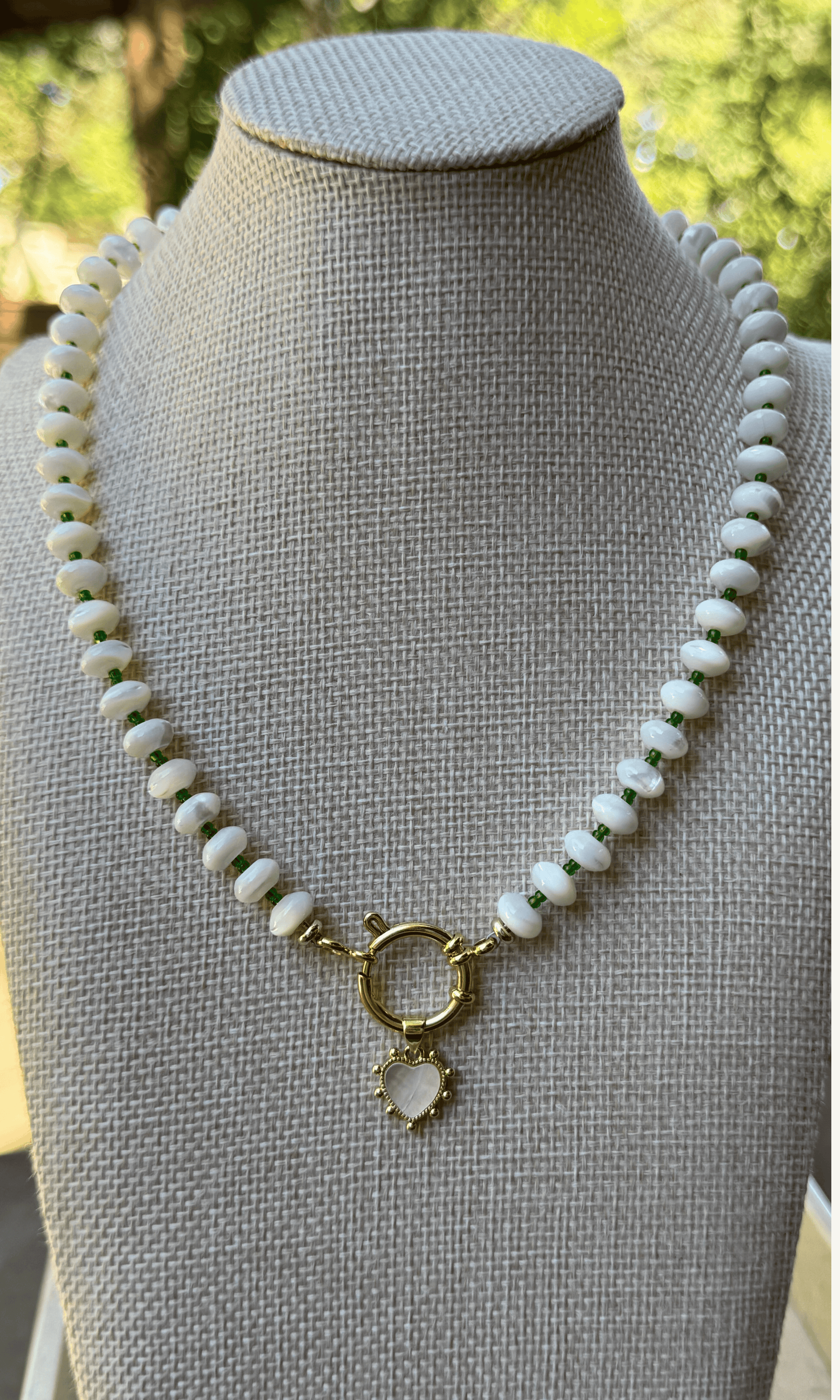 White Mother of Pearl candy-style necklace with custom color spacer beads, Mother of Pearl heart charm, gold filled findings, and sailor clasp
