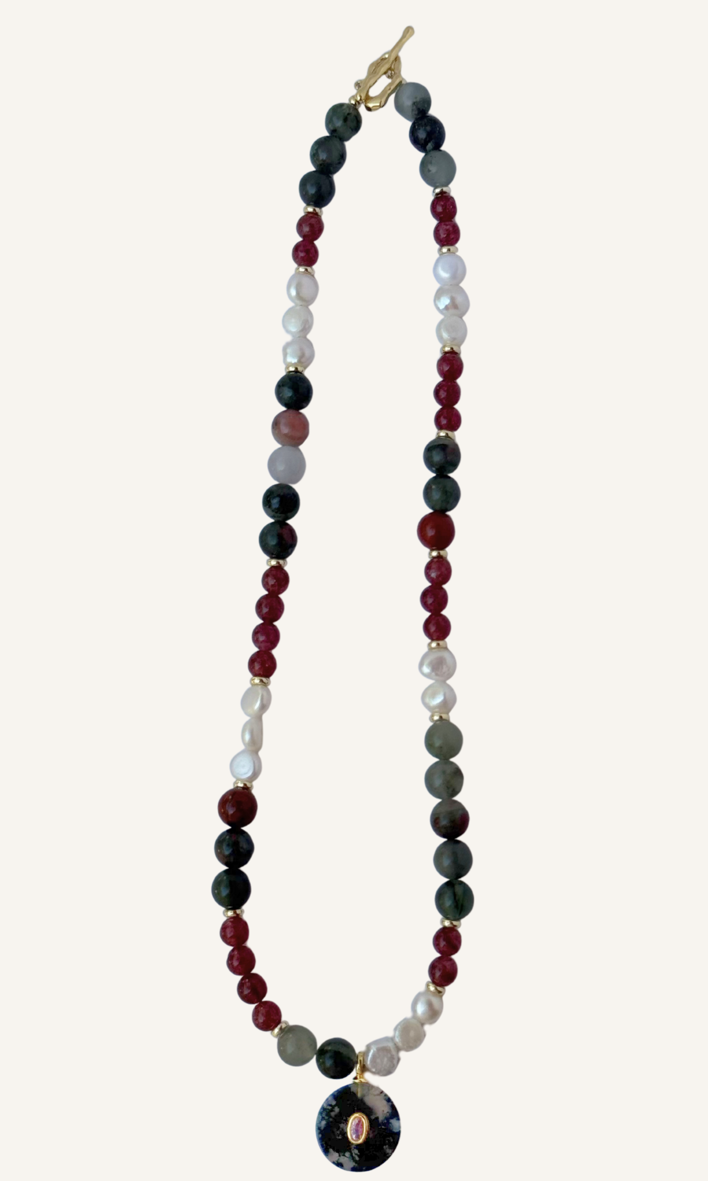 African Bloodstone, Strawberry Quartz, and Freshwater Pearl necklace with a Green Agate and Pink Cubic Zirconia charm, gold filled findings, and a toggle clasp