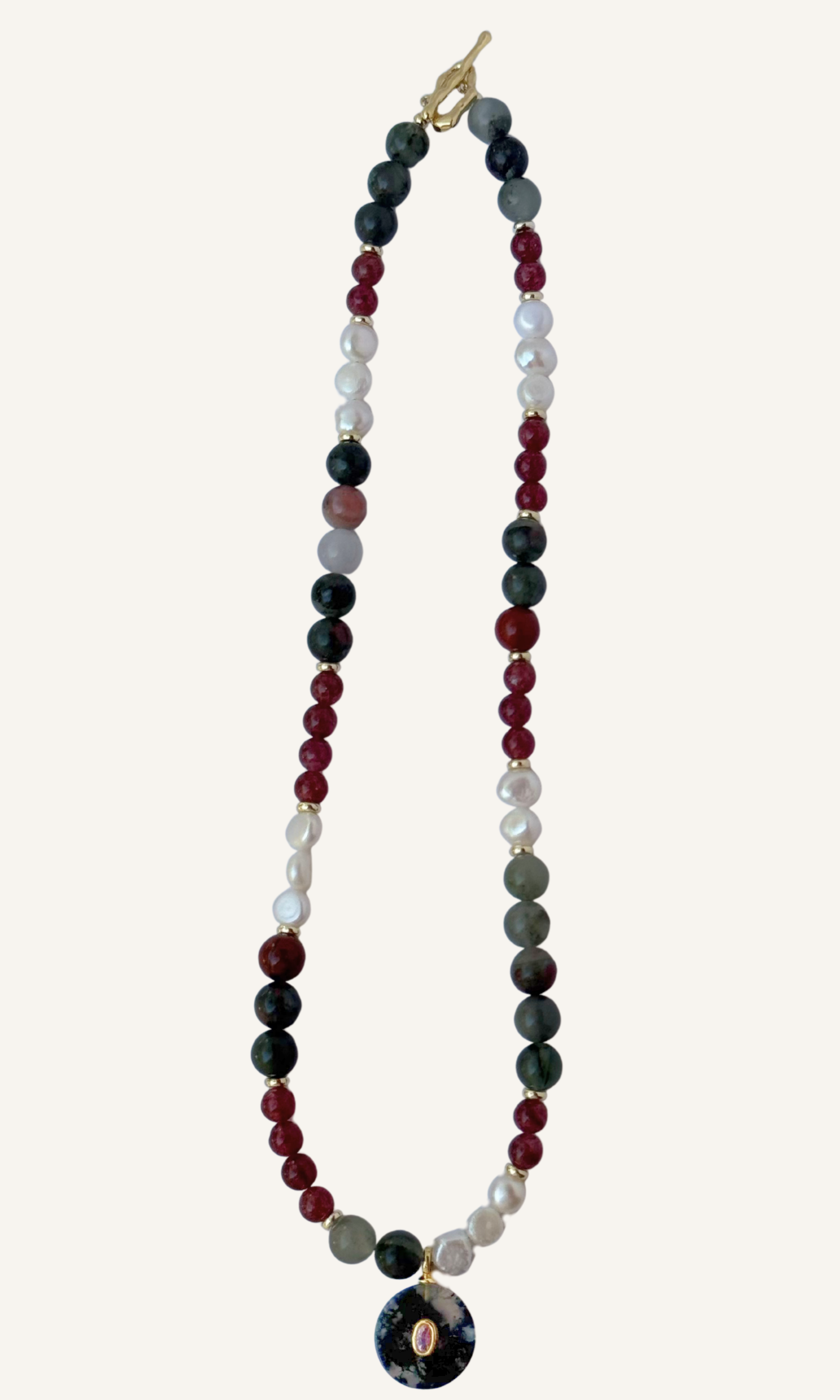 African Bloodstone, Strawberry Quartz, and Freshwater Pearl necklace with a Green Agate and Pink Cubic Zirconia charm, gold filled findings, and a toggle clasp
