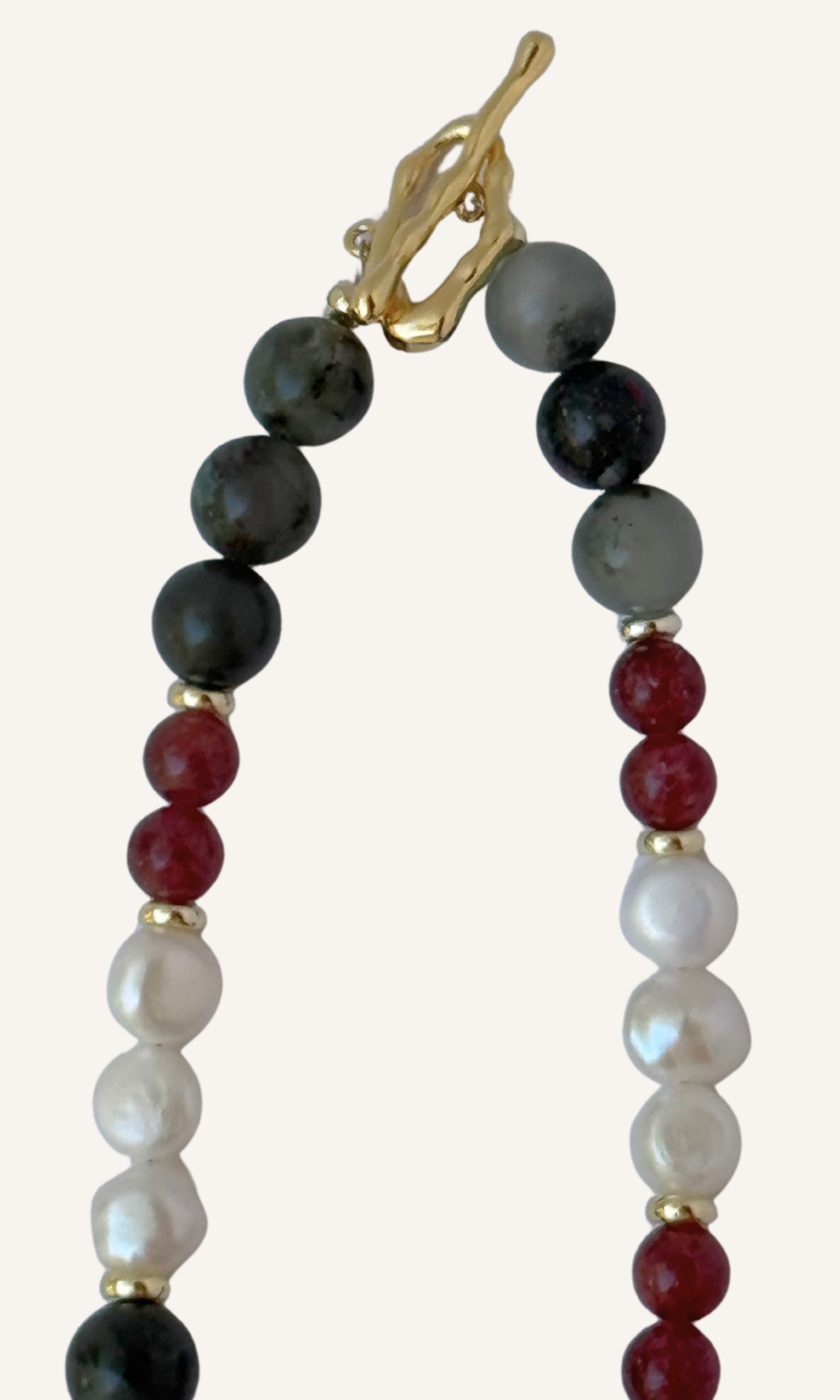 African Bloodstone, Strawberry Quartz, and Freshwater Pearl necklace with a Green Agate and Pink Cubic Zirconia charm, gold filled findings, and a toggle clasp
