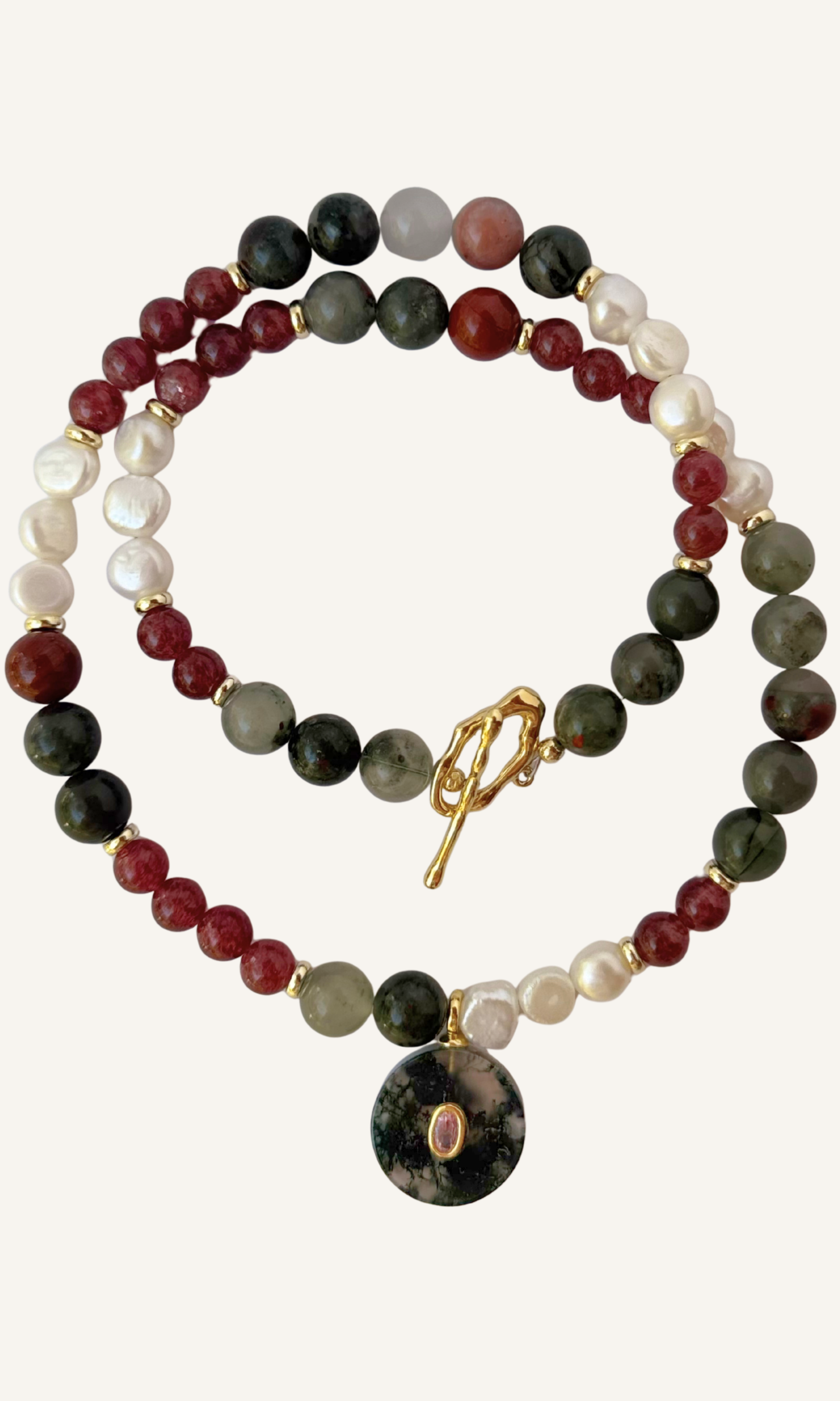 African Bloodstone, Strawberry Quartz, and Freshwater Pearl necklace with a Green Agate and Pink Cubic Zirconia charm, gold filled findings, and a toggle clasp