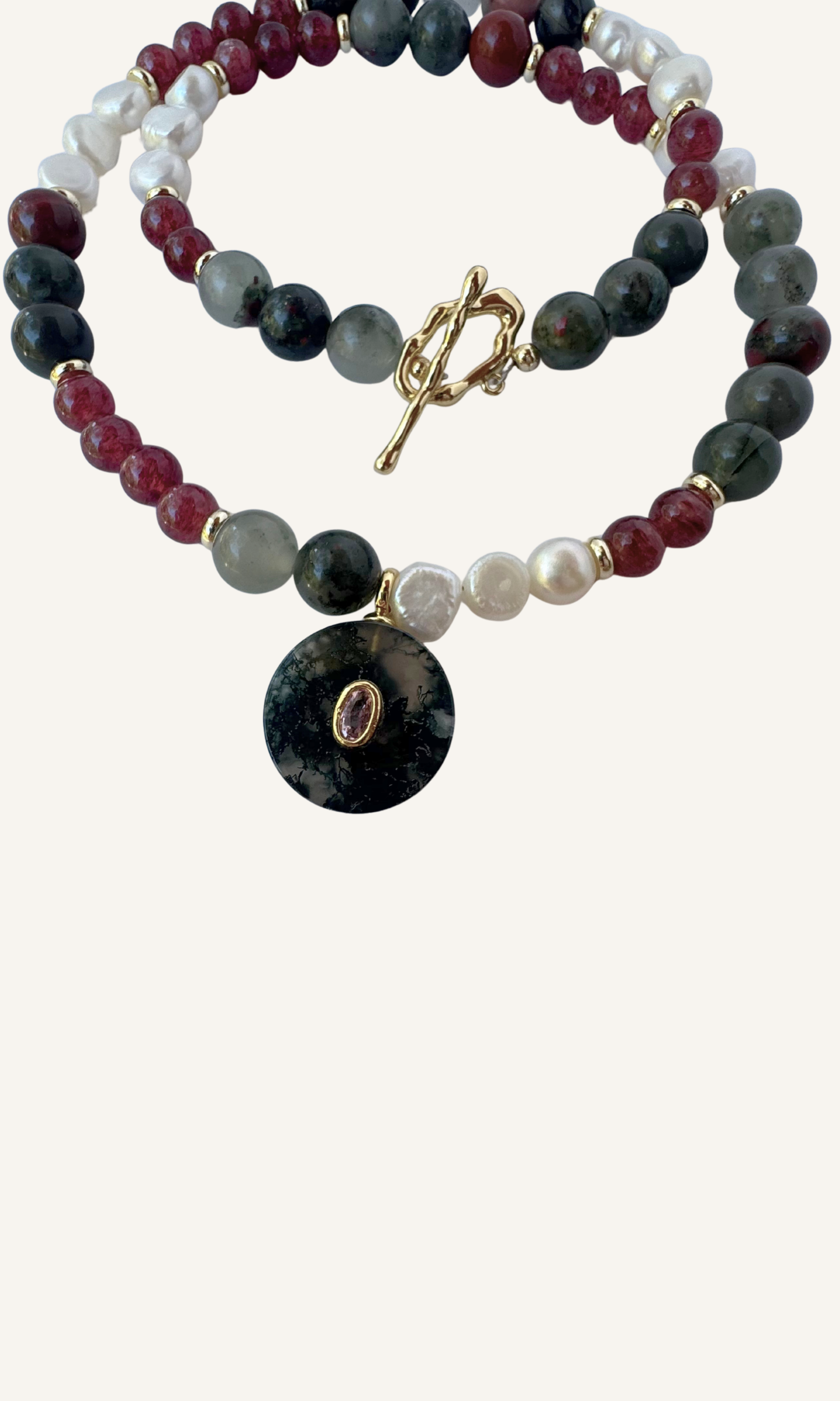 African Bloodstone, Strawberry Quartz, and Freshwater Pearl necklace with a Green Agate and Pink Cubic Zirconia charm, gold filled findings, and a toggle clasp