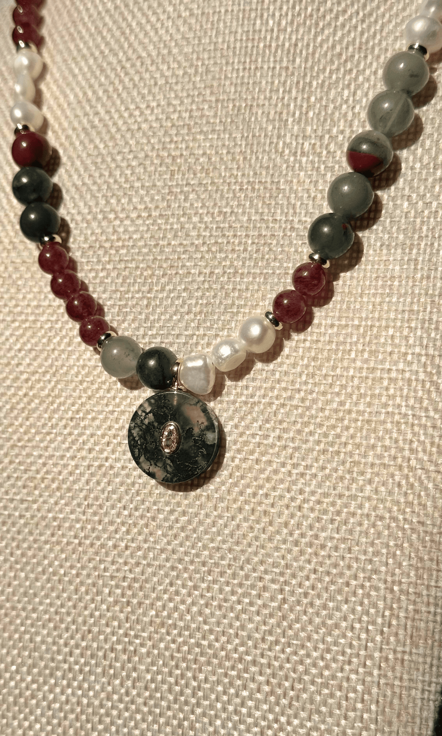 African Bloodstone, Strawberry Quartz, and Freshwater Pearl necklace with a Green Agate and Pink Cubic Zirconia charm, gold filled findings, and a toggle clasp