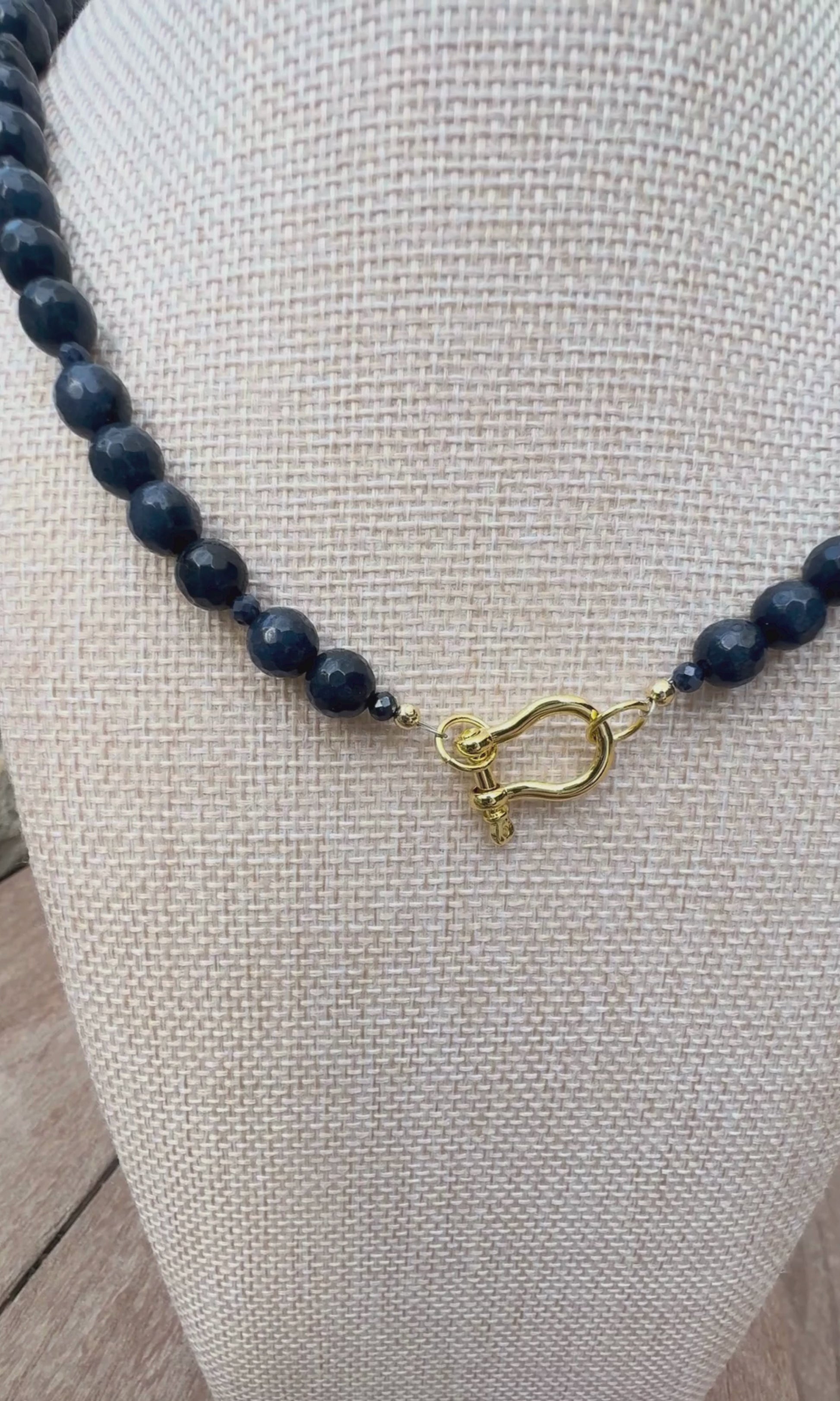 Video of Midnight Jade and Blue Sapphire necklace with gold filled hardware including a horsebit connector and magnetic closure